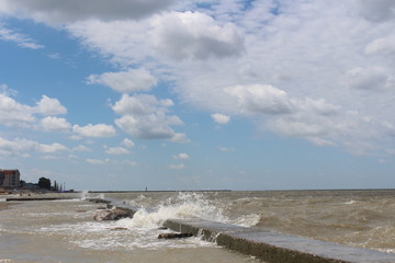 Waves and wind on the beach in summer