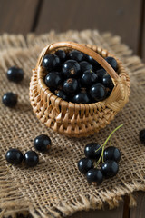 black currant on wooden surface