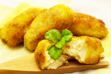 Stuffed croquettes on wooden fork