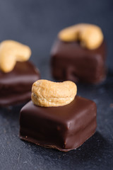 Handmade chocolate bonbons with cashew