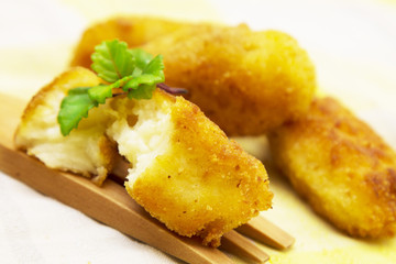 Stuffed croquettes on wooden fork