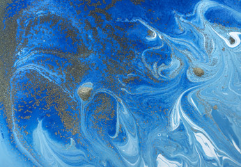 Marbled blue and golden abstract background. Liquid marble pattern