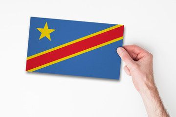 Male hand holding democratic republic of congo flag