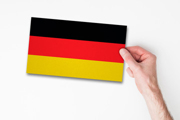 Male hand holding germany flag