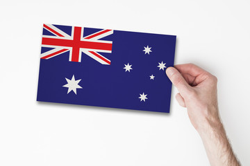 Male hand holding australia flag