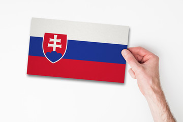 Male hand holding slovakia flag