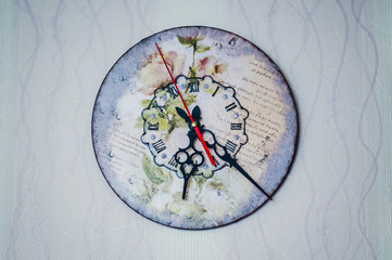 Beautiful decorated clock in vintage style. The clock shows six o'clock in the evening