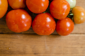 Tomato on the wooden table. Fresh background. Wooden background.