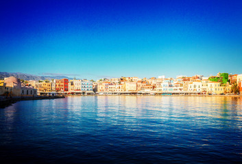 Fototapeta na wymiar waterfront of Chania bay at sunny day, Crete island, Greece, retro toned
