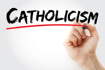 Hand writing Catholicism with marker, concept background
