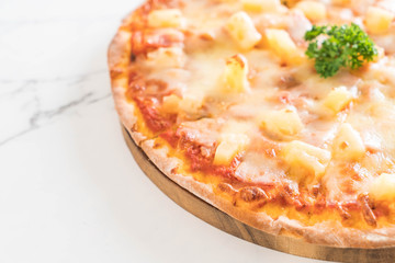 hawaiian pizza on table