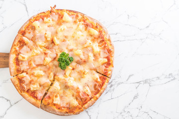 hawaiian pizza on table