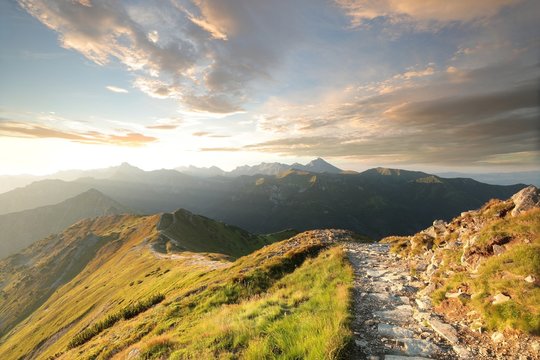 Trail among the peaks in the Carpathian Mountains at dawn
