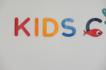 Kids tag on white wall