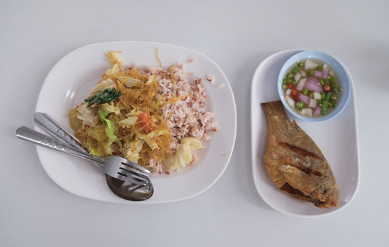Thai food Pla Nil Tod and brown rice