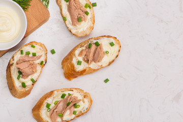 Bruschetta. Sandwich tuna fish salad on wooden background