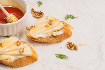 Appetizer bruschetta with apple, honey, walnuts, selective focus