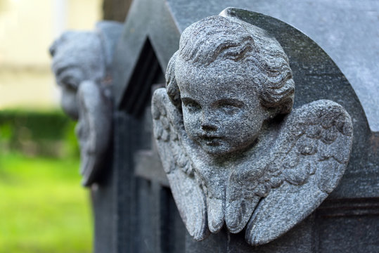 Sculptural image of an angel carved on a granite