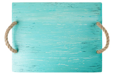 Wooden chopping board painted with turquoise paint