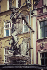 Fototapeta na wymiar Fountain of the Neptune in old town of Gdansk, Poland