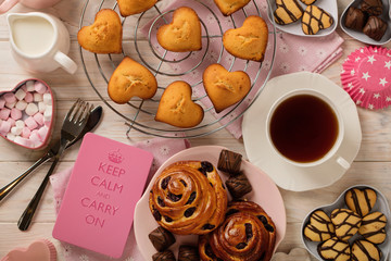Flat lay cakes and cookies, muffins and rolls, biscuits and sweets, tea and coffee with marshmallow.