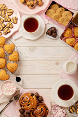 Flat lay cakes and cookies, muffins and rolls, biscuits and sweets, tea and coffee with marshmallow.
