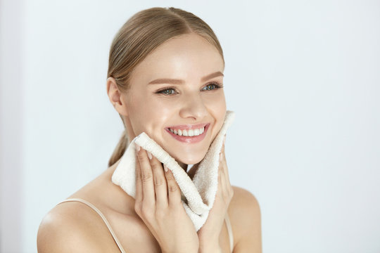 Cleaning Face Skin. Beautiful Happy Girl Washing Face