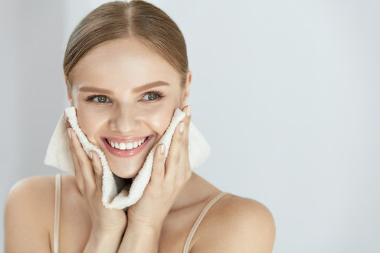 Cleaning Face Skin. Beautiful Happy Girl Washing Face