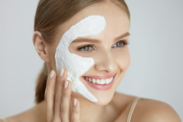 Face Mask. Portrait Of Beautiful Smiling Girl With White Mask