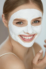 Skin Care Mask. Close Up Of Woman With White Face Mask