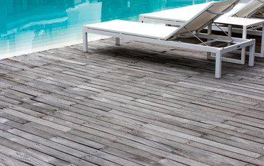 Wooden floor, swimming pool and white pool bed