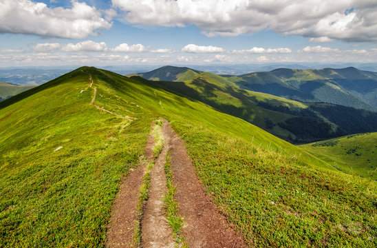 footpath on top of a mountain ridge in summer