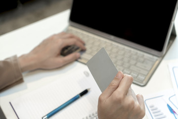 Credit card in female hand