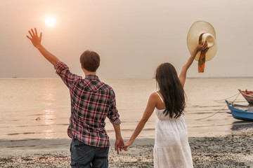 The Romantic lover standing on beach goodbye sun