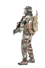 Special forces United States in Camouflage Uniforms studio shot. Holding weapons, wearing jungle hat, Shemagh scarf, painted face, his outfit clothes designed for jungle warfare. Studio shot isolated