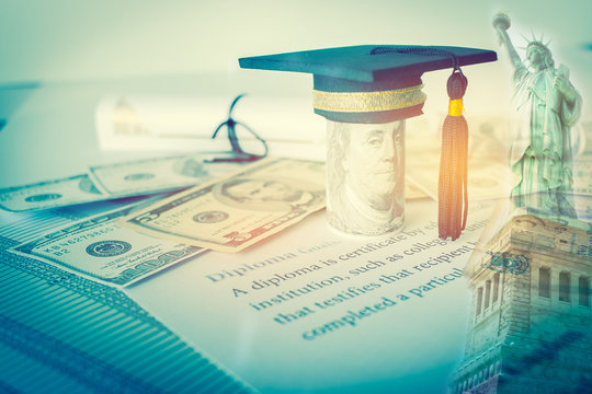 Concept Of Graduation Black Cap On Dollars Bill, Diploma On Letters, Foreign Money US Dollars, Education Of America Competition On Abroad Program In Usa Famous Institution, Liberty Background.