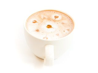 white cup of hot cacao, top with heart shape cacao powder on steam foam milk