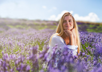 Fototapeta na wymiar Lovely cute woman in lavender field at sunny day freedom concept