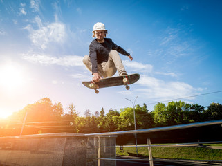 Skatboarder practicing and jumping on the streets. © romaset