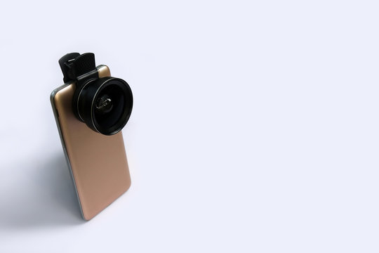 Clip lens with mobile phones in white background.