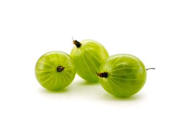 Green gooseberries on white