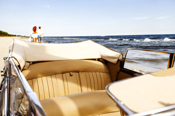 retro car on beach 