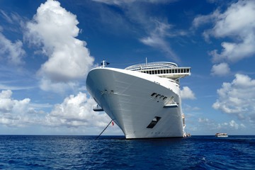 Cruise ship in crystal blue water with blue sky