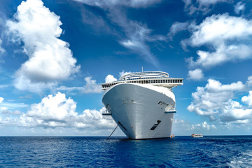 Cruise ship in crystal blue water with blue sky