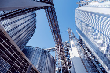 Fototapeta na wymiar Modern silos for storing grain harvest. Agriculture.