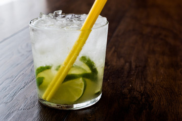 Caipirinha Cocktail with lime and ice.