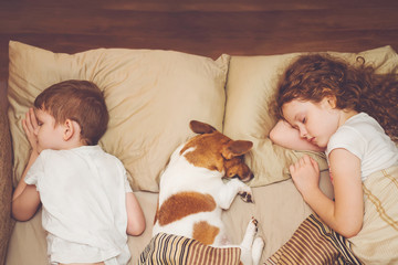 Cute children and her puppy with sleep.