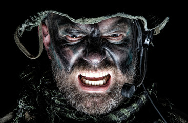 United States Commando face studio shot. Mouth opened, soldier yelling, emitting intimidate...