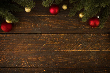 Fototapeta na wymiar Christmas background - Christmas fir tree and decorating rustic elements on vintage wood table. Creative Flat layout and top view composition with border and copy space design. vintage color tone