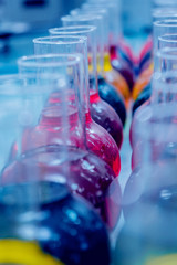 Laboratory glassware with colored liquid.